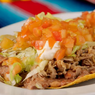 Tostada (Carnitas, Res o  Carnitas al Pastor)